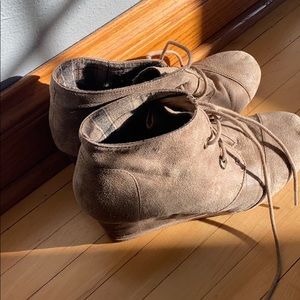 Tan/brown wedge boots.